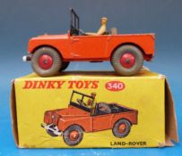 A Dinky Toys diecast model Land Rover in orange livery with orange hubs 340 (in original box)