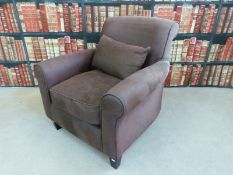 A brown suede armchair