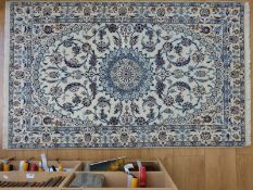 A Persian Nain wool and silk rug (originally purchased from Harrods) (165 x 100cm)