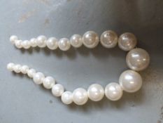 A large decorative string of pearls (formerly used in a window display at Accessorize)