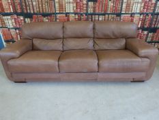 A brown leather three seat sofa (length 242cm)