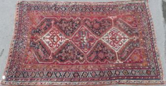 A handmade pale blue and pink rug (223 x 139cm)