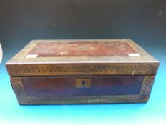 A 19thC rosewood writing slope with Greek key decoration in brass,