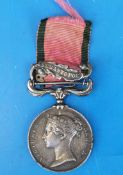 A Crimea War medal dated 1854 with Sebastopol clasp and ribbon awarded to Gr and Dr T Childs 6th Bn