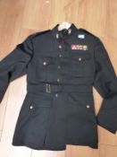 An American military tunic and trousers with collar insignia and medal bars