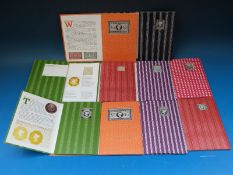 A collection of silver 'Victorian Stamp Ingot Collection' packets in original boxes comprising ten