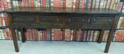 A rustic elm four drawer dresser of pegged construction (W180 x D41 x L78cm)