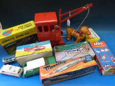 A collection of various toys including a Louis Marx Corvette Sting Ray,