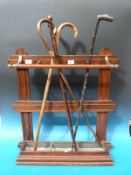 A 19thC stick stand together with four sticks