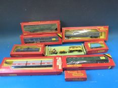Twenty Tri-ang and Hornby 00 gauge carriages and wagons,
