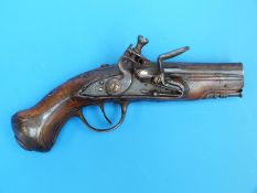 A French flintlock pocket pistol with silver inlaid and ornately carved grip and remnants of gilt