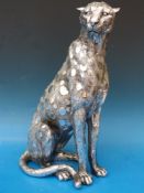 A modern silvered sculpture of a cheetah,