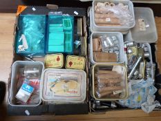 Two trays of rod-making equipment