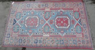 A navy blue rug with central geometric design (152 x 109cm)