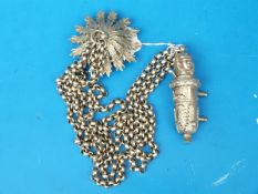 A white metal military whistle,