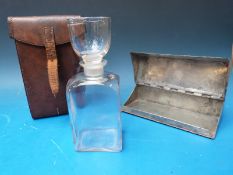 A 19thC / 20thC leather-cased metal sandwich box and metamorphic decanter / glass.