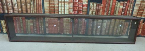 A counter top haberdashery shop or collector's display cabinet with two mirrored drop down doors to