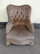 A 19thC button-back armchair