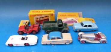 Six Dinky Toys diecast model vehicles together with two empty boxes