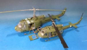 Two model military helicopters