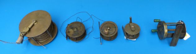 Five vintage brass fishing reels, one stamped made in England and two with horn handles,