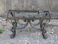 A cast iron coffee table base