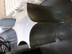 A retro stainless steel scalloped design coffee table