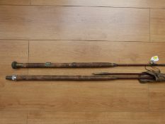 A vintage cane fishing rod by JJS Walker & Co,