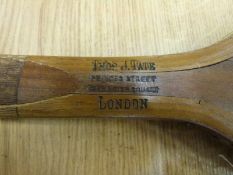 A 19thC lopsided or tilt head tennis racquet impressed 'Tate' to head and 'Thomas  J.