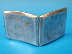 A hallmarked silver cigarette case dated to front 1915-1924 and engraved to the back with ten