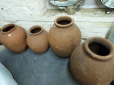 Four terracotta amphora/jardinieres,