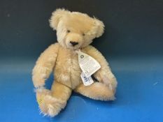 A Merrythought blonde mohair bear with jointed limbs and shaved snout, 37cm tall.