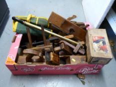 A quantity of vintage woodworking tools to include plough and other planes,