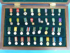 A cased collection of Rhodesian miniature medals by Reuteler of Salisbury 163 of 500 sets,