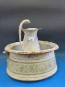 A metal Art Deco jug and bowl.