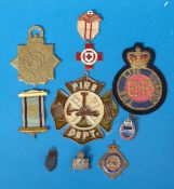 A collection of various badges to include lifeguards, fire dept, Red Cross, civil nursing,