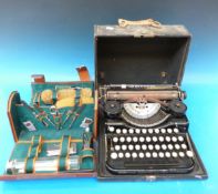 A leather cased travelling set with brushes, scissors,