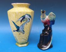 A Wilkinson pottery vase with bird finial,