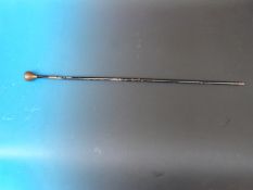 A swordstick with bronze and white metal handle, the top with the  family crest and motto 