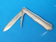 A white metal folding fruit knife with fold out blade and pick,