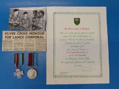 A Rhodesian pair of medals for bravery including a silver cross and General Service Medal awarded