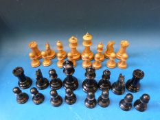 A wooden chess set, possibly Staunton, in mahogany box. Height of King 4.