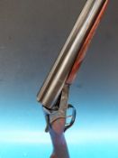 A 12 bore Baikal side by side shotgun with double trigger,