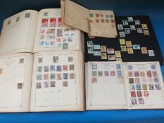 A collection of Dutch stamps and four albums of all world stamps including Victorian