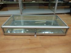 A modern aluminium framed lockable display case (L120 x W60 x D20cm)