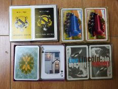 Approximately 60 double packs of playing cards to include promotional including shipping,