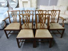 A set of six 2 x 4 mahogany dining chairs in the Chippendale style with drop-in upholstered seats