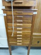 An oak collector's chest of 11 drawers with divisions (W40 x D39 x H93cm)