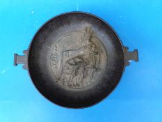 A German Spelter and cast pedestal bowl with a classical figure in relief to the bowl,