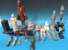A quantity of ancient Egyptian-style figures together with various other tribal and similar style